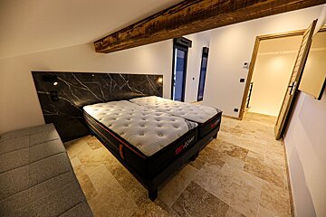 A bed with a mattress that says best comfort on it