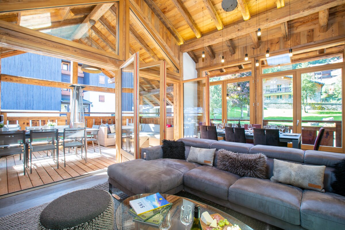 A living room with a couch and a book that says j & t on it