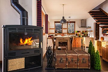 A living room with a fireplace and a trunk