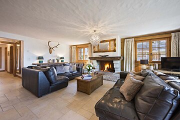 A living room filled with furniture and a fireplace