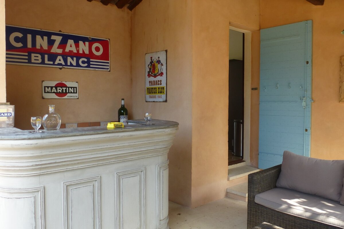 A bar with a sign that says cinzano blanc