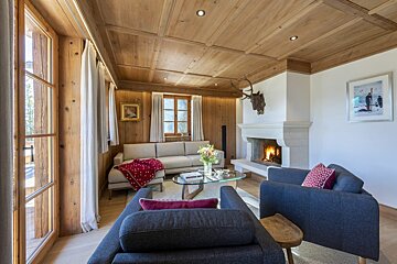 A living room with a fireplace and a couch
