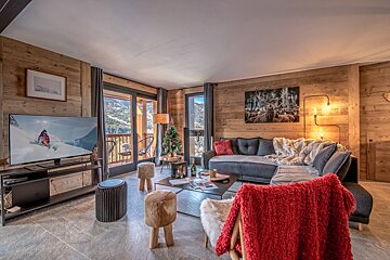 A living room with a couch and a flat screen tv