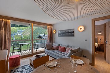 A living room with a couch and a table