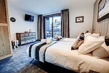 The number 23 is on the wall above the bed