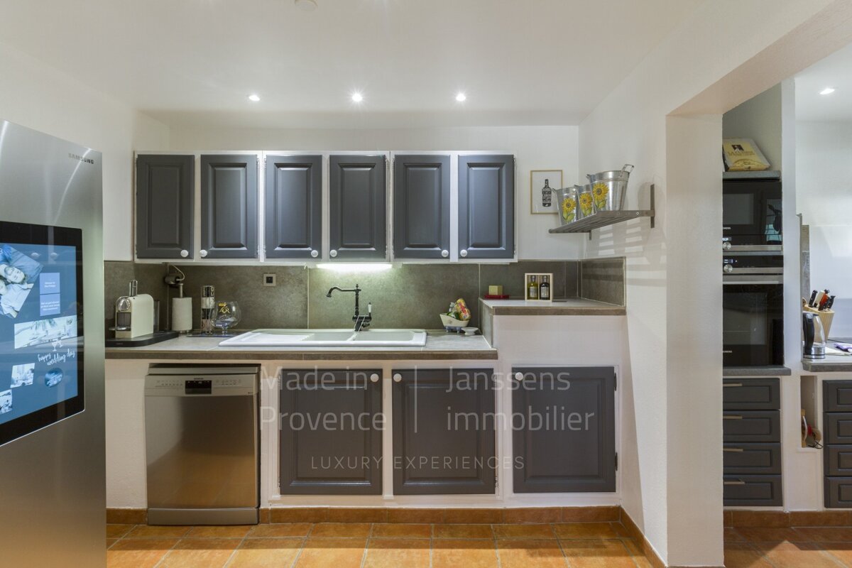 A kitchen with made in provence written on the wall