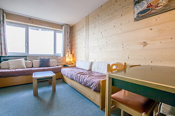 A living room with a couch and a table