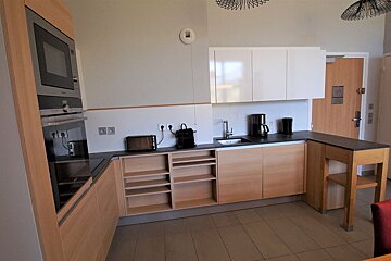 A kitchen with wooden cabinets and a siemens oven