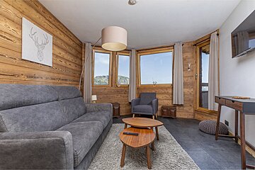 A living room with a couch and a chair