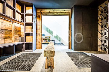 A wooden bench in a room with a sign that says kristi holidays