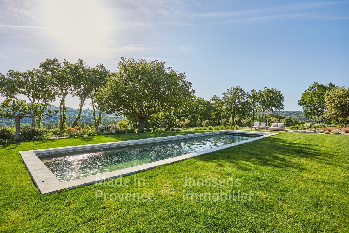 A large swimming pool with the words made in provence on the bottom