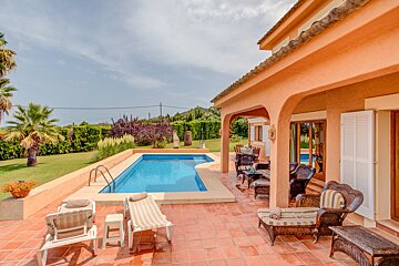 A house with a large swimming pool in the backyard