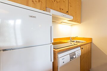 A kitchen with a laiden refrigerator and a vivo dishwasher