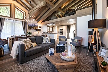 A living room with a couch and a coffee table