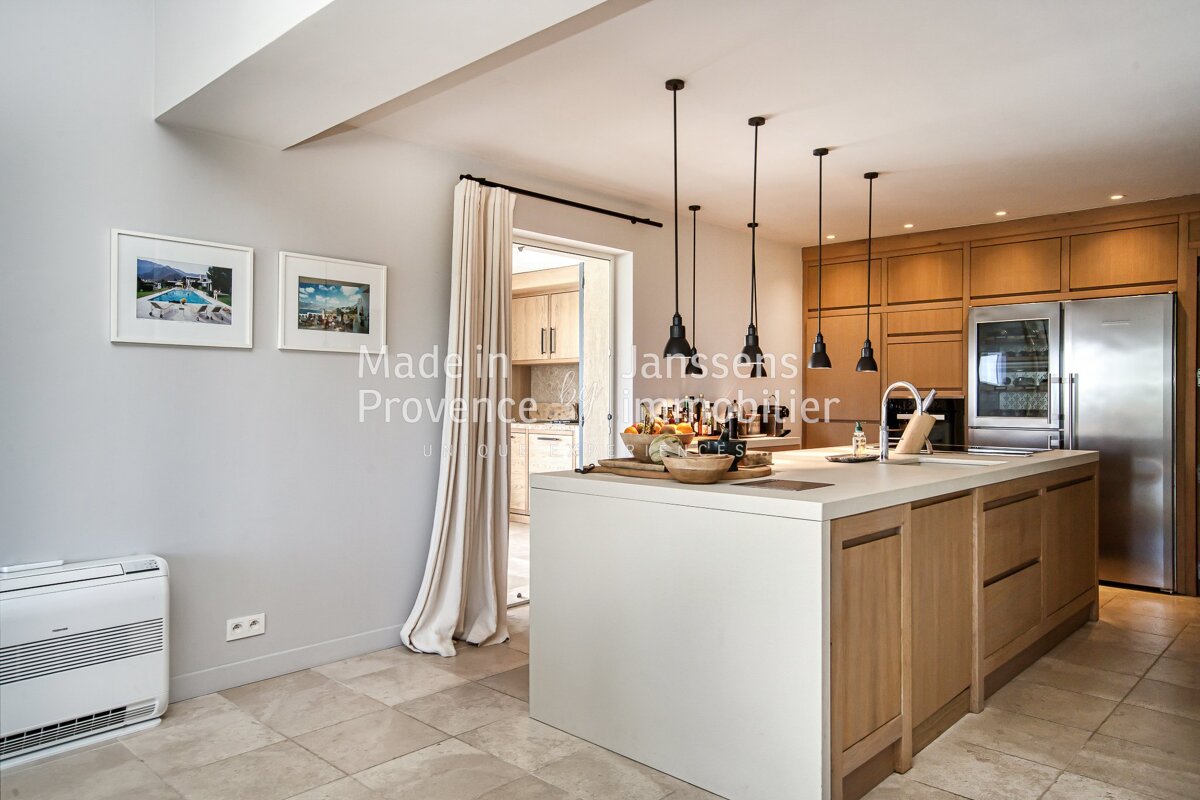 A kitchen with the word madelin on the wall