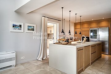 A kitchen with the word madelin on the wall