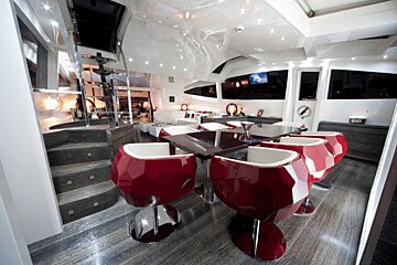 A room with red and white chairs and a table