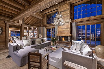 A living room filled with furniture and a fireplace