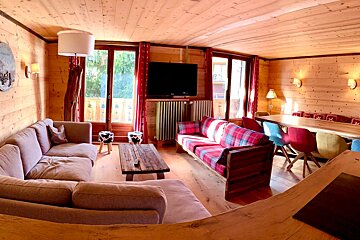 A living room with a couch and a flat screen tv