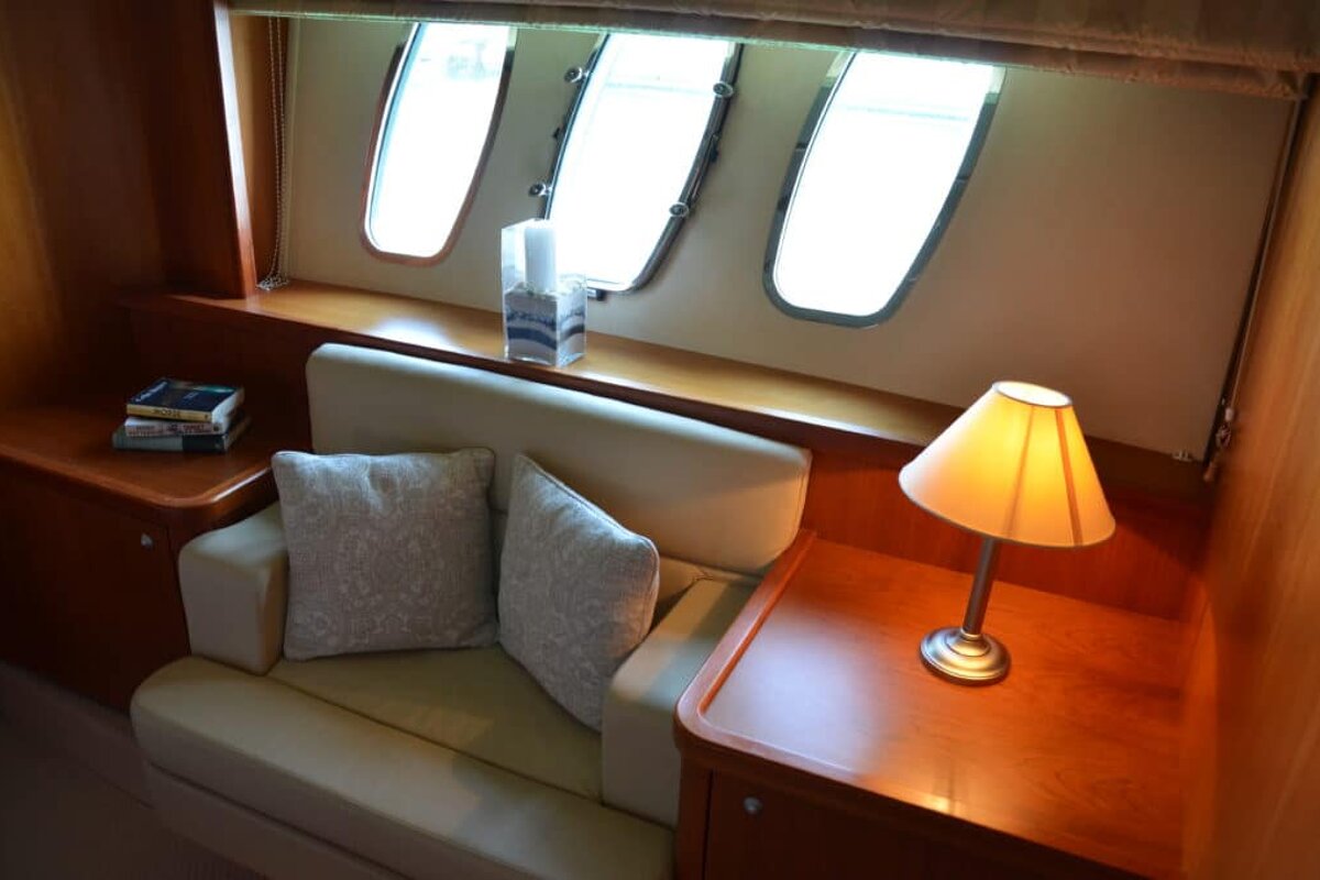 A lamp sits on a table next to a couch