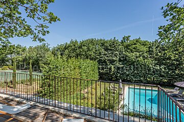 A view of a swimming pool from a balcony