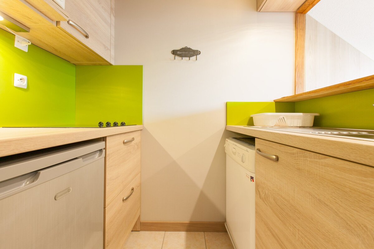 A kitchen with a sign on the wall that says welcome