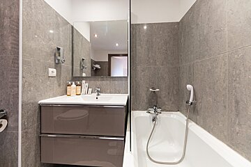 A bathroom with a sink and a bathtub