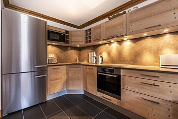 A white van is parked in front of a building that says sport