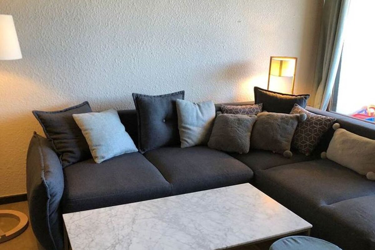 A living room with a couch and a coffee table