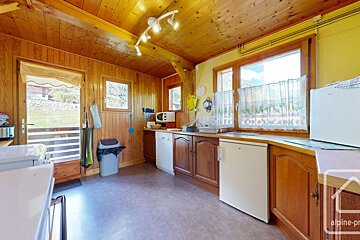 A kitchen with the word alpine on the bottom right