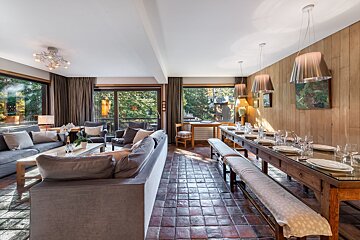 A living room with a couch and a table with plates on it