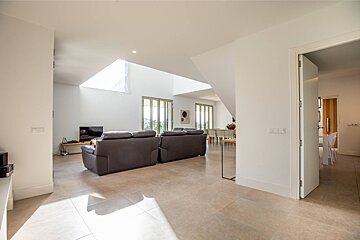 A living room with two couches and a flat screen tv
