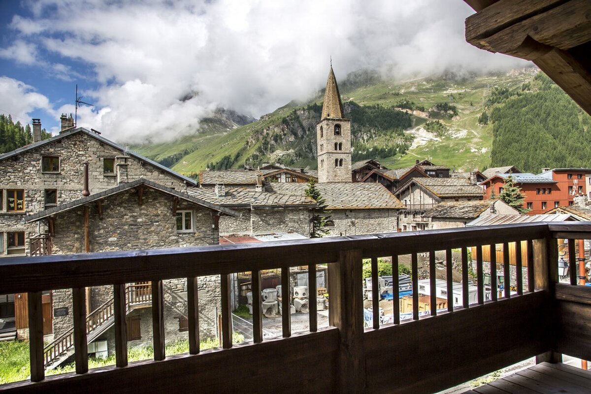 A view of a mountain village from a balcony