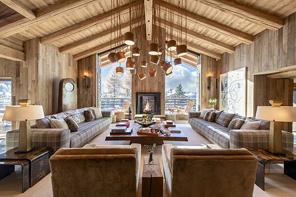 A living room with lots of furniture and a fireplace