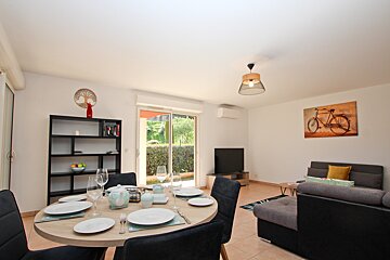 A living room with a picture of a bicycle on the wall