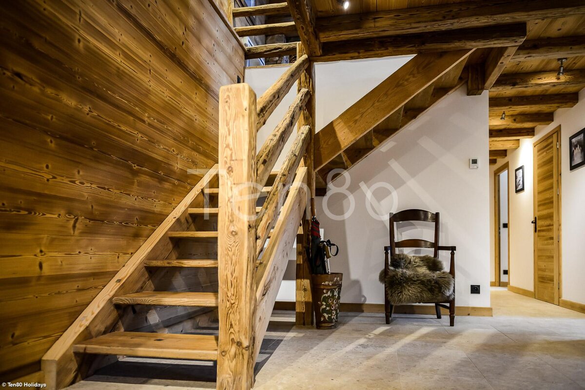 A wooden staircase leading up to the second floor