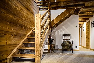 A wooden staircase leading up to the second floor