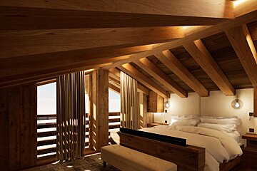 A bedroom with a wooden ceiling and a bed