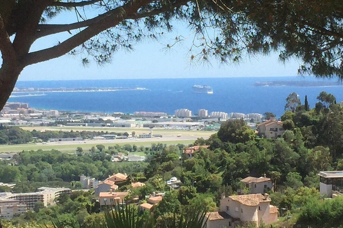 A view of a city with a large body of water in the background
