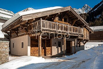 A snowy house with the word holidays on it