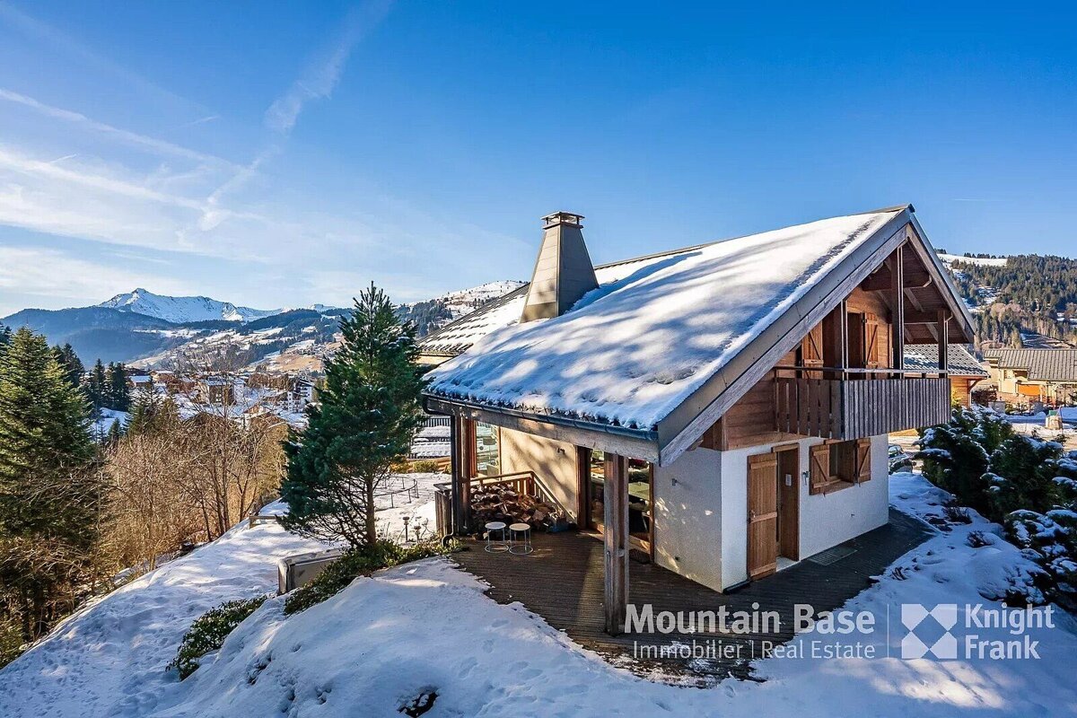 A snowy house with the words mountain base written on it