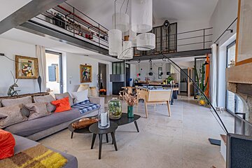 A living room with a couch and two coffee tables
