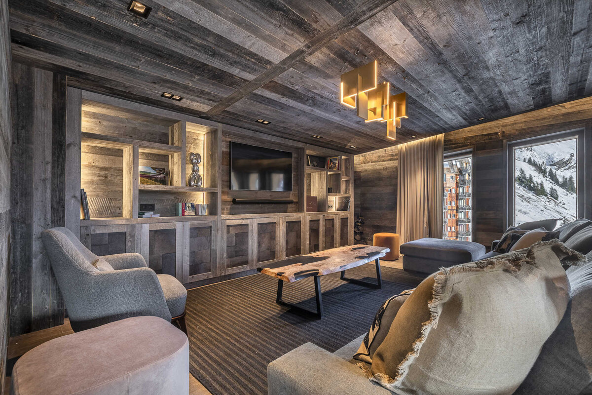 A living room filled with furniture and a television