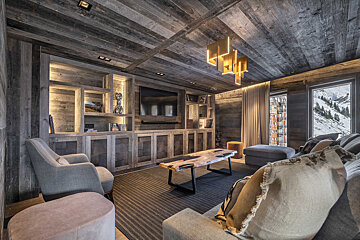 A living room filled with furniture and a television