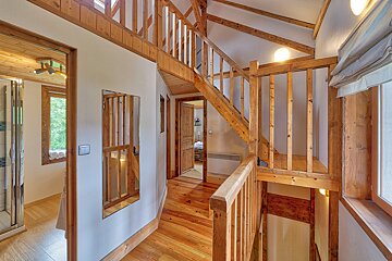 A wooden staircase leading up to the second floor of a house