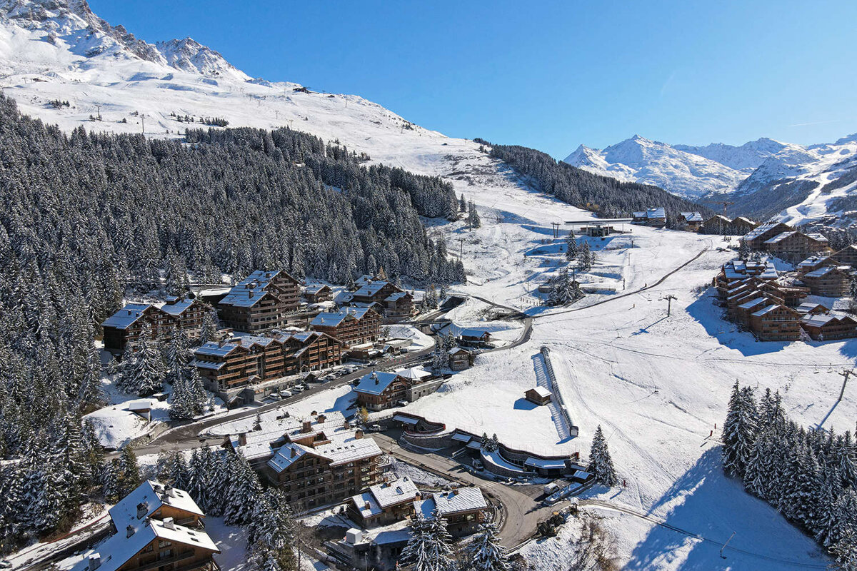 An aerial view of a ski resort in the mountains