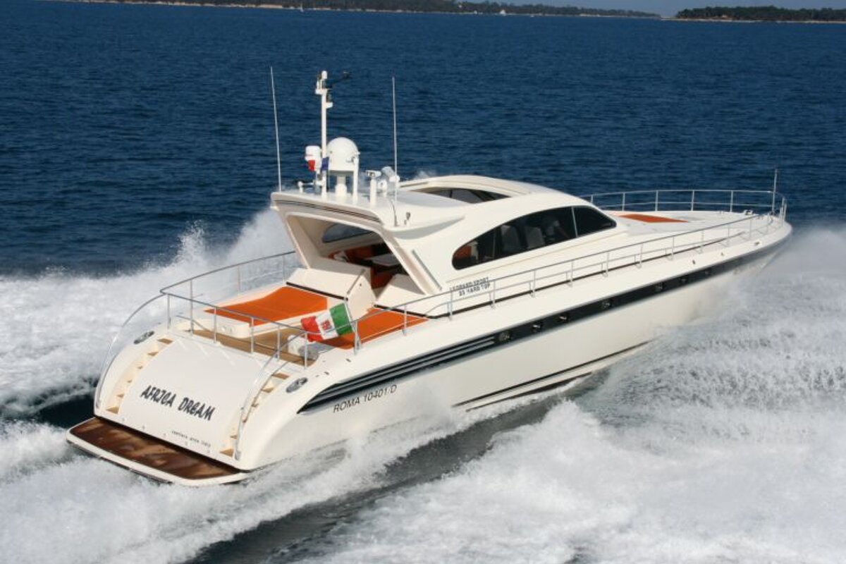 A white boat with the word arena on the back