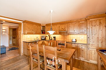 A kitchen with wooden cabinets and a table that says vip on it