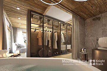 A luxurious rustic-modern bathroom featuring a foreground bathtub, an illuminated open closet, wood ceiling, and a bright view into an adjacent room.