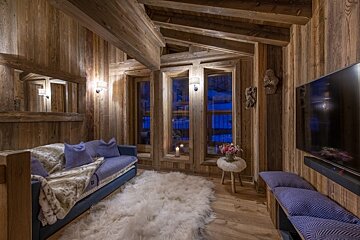 A living room with a couch and a flat screen tv